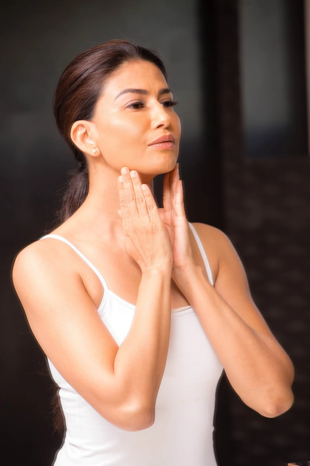 Uma demonstrating gentle neck massage