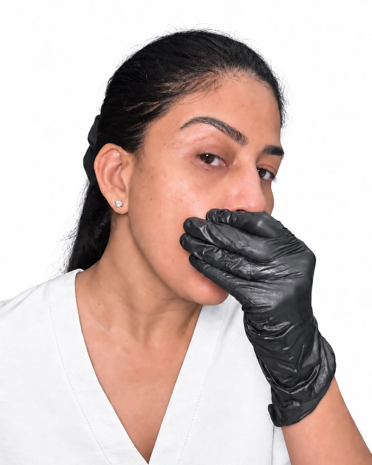 Uma demonstrating buccal self-massage with a gloved hand